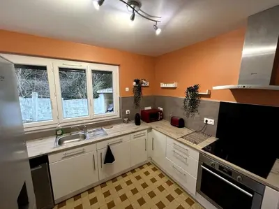 Cuisine ou kitchenette dans l'établissement Gîte La Bienvenue