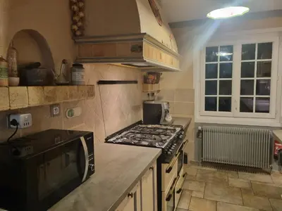 Cuisine ou kitchenette dans l'établissement A la maison du bonheur