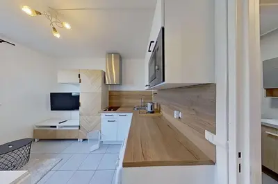 Cuisine ou kitchenette dans l'établissement Studio Cosy proche Gare de Poissy RER A