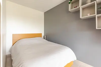 Un ou plusieurs lits dans un hébergement de l'établissement La Côte Verte Studio charme