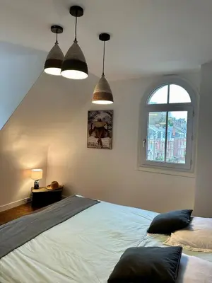 Un ou plusieurs lits dans un hébergement de l'établissement Le Magnolia Maison 12 Couchages