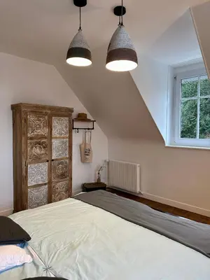 Un ou plusieurs lits dans un hébergement de l'établissement Le Magnolia Maison 12 Couchages