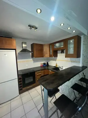 Cuisine ou kitchenette dans l'établissement Appartement (CERGY)