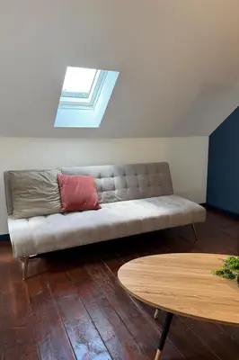 Coin salon dans l'établissement Chambre privée 