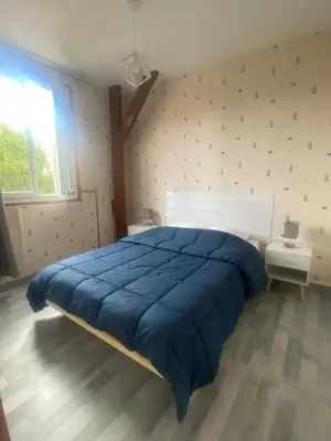 Un ou plusieurs lits dans un hébergement de l'établissement Maison calme