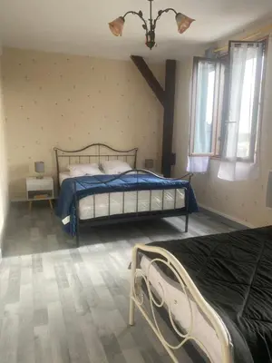Un ou plusieurs lits dans un hébergement de l'établissement Maison calme
