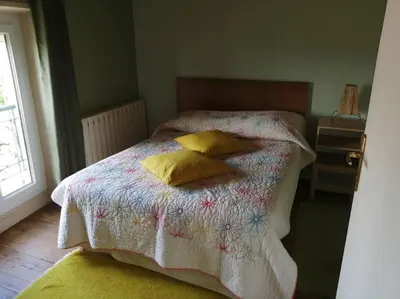 Un ou plusieurs lits dans un hébergement de l'établissement Gite du Colombier