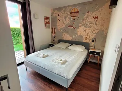 Un ou plusieurs lits dans un hébergement de l'établissement Villa en bois à la campagne - 20 min de Rouen