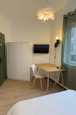 Télévision ou salle de divertissement dans l'établissement Chambre privée 