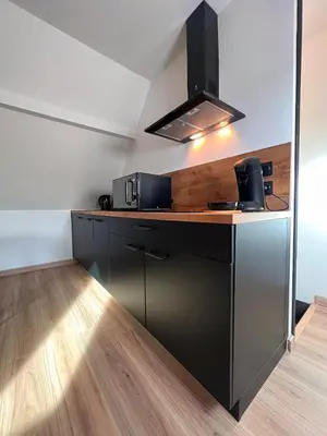 Cuisine ou kitchenette dans l'établissement L'Escale Suite & Spa