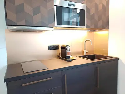 Cuisine ou kitchenette dans l'établissement L'escapade - A 5min à pied centre ville & gare