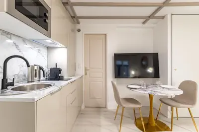 Cuisine ou kitchenette dans l'établissement Villa Caron - Studios haut de gamme hyper centre