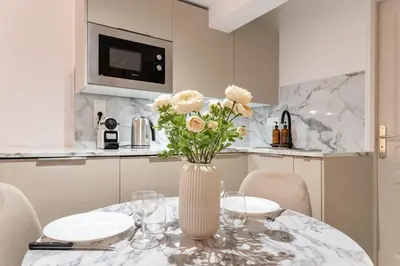Cuisine ou kitchenette dans l'établissement Villa Caron - Studios haut de gamme hyper centre