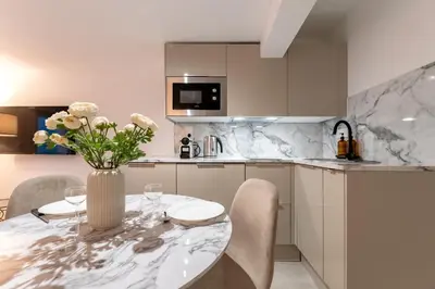 Cuisine ou kitchenette dans l'établissement Villa Caron - Studios haut de gamme hyper centre