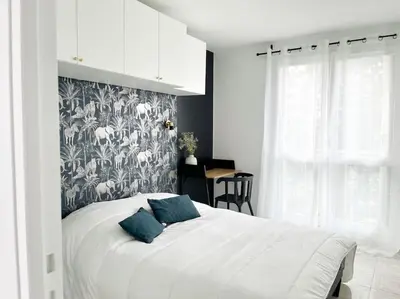 Un ou plusieurs lits dans un hébergement de l'établissement Appartement élégant-Patte d'Oie