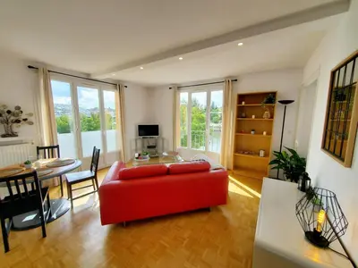 Coin salon dans l'établissement Le Loft de L’Écluse / F2 cosy au bord de l'eau