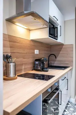 Cuisine ou kitchenette dans l'établissement Appartement Cosy Rouen