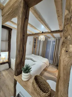 Un ou plusieurs lits dans un hébergement de l'établissement Le Cœur du Bien-être - Gîte grande capacité - 6 chambres - Superbe emplacement - Vue Seine - Décoration soignée - Coin touristique