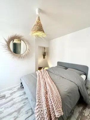 Un ou plusieurs lits dans un hébergement de l'établissement Maison de Ville Rénovée avec Charme