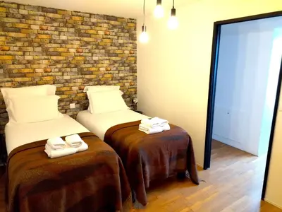 Un ou plusieurs lits dans un hébergement de l'établissement Gite de Amiens Poulainville