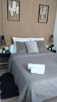 Un ou plusieurs lits dans un hébergement de l'établissement Chic Oasis in Rouen
