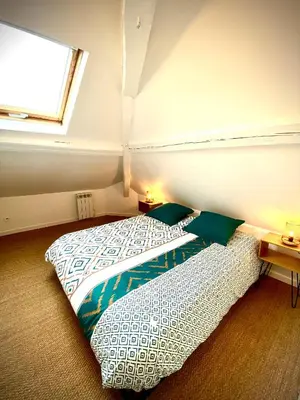 Un ou plusieurs lits dans un hébergement de l'établissement Le Duplex Rouen Cocooning Rouen Centre Parking