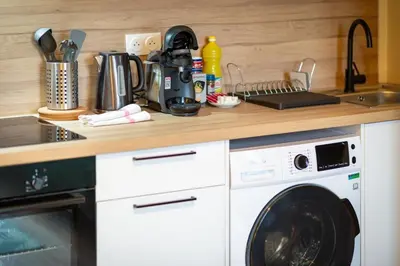 Cuisine ou kitchenette dans l'établissement Mathilde Appartement proche Clinique Mathilde