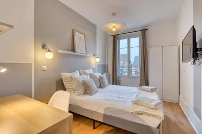 Un ou plusieurs lits dans un hébergement de l'établissement Mathilde Appartement proche Clinique Mathilde