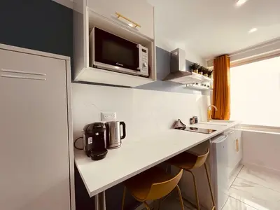 Cuisine ou kitchenette dans l'établissement La balnéo de l'impératrice Anastasia - 306