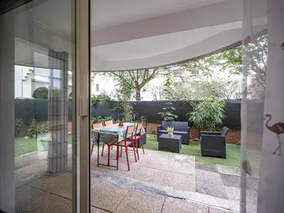 Jardin de l'établissement Appartement cocooning en centre-ville - Résidence le Colisée