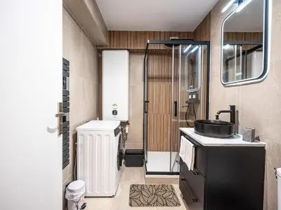 Salle de bains dans l'établissement Appartement cocooning en centre-ville - Résidence le Colisée