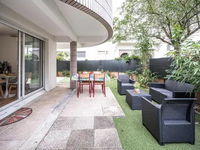 Coin salon dans l'établissement Appartement cocooning en centre-ville - Résidence le Colisée