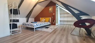 Un ou plusieurs lits dans un hébergement de l'établissement Maison familiale avec extérieur Ménage et linges inclus