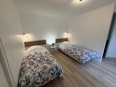 Un ou plusieurs lits dans un hébergement de l'établissement Gîte Mer et Campagne