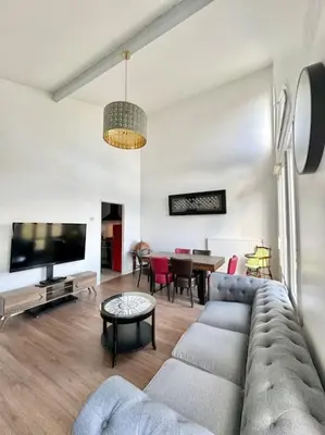 Télévision ou salle de divertissement dans l'établissement Home seventy - Guest House
