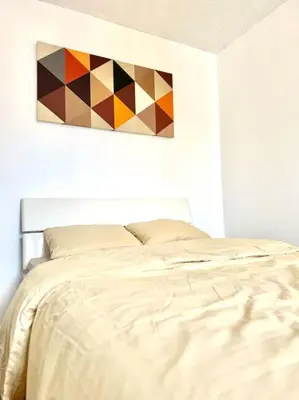 Un ou plusieurs lits dans un hébergement de l'établissement Home seventy - Guest House