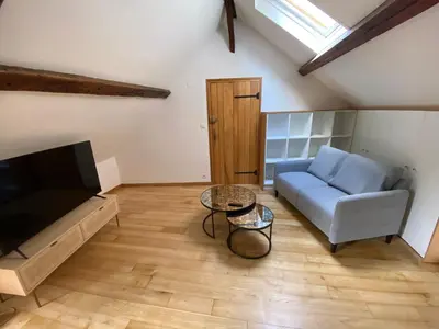 Télévision ou salle de divertissement dans l'établissement L'enclave intime