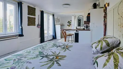 Un ou plusieurs lits dans un hébergement de l'établissement Maisonnette cosy bord de Seine 30min paris