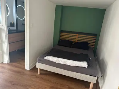 Un ou plusieurs lits dans un hébergement de l'établissement Charmant Duplex parking en option