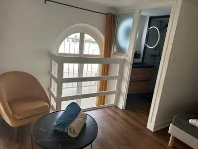 Coin salon dans l'établissement Charmant Duplex parking en option