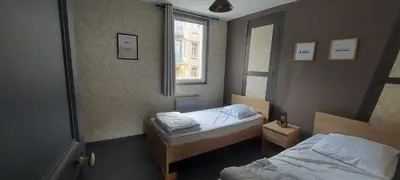 Un ou plusieurs lits dans un hébergement de l'établissement Les Parisiennes -Hypercentre