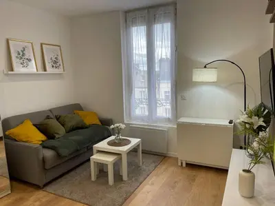 Coin salon dans l'établissement Appartement cosy hyper centre