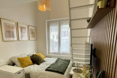 Un ou plusieurs lits dans un hébergement de l'établissement Duplex cosy hyper centre