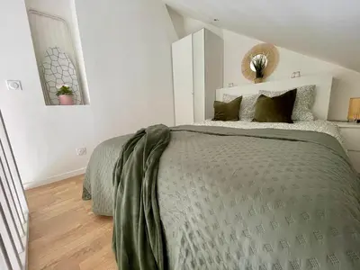 Un ou plusieurs lits dans un hébergement de l'établissement Duplex cosy hyper centre