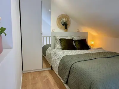 Un ou plusieurs lits dans un hébergement de l'établissement Duplex cosy hyper centre
