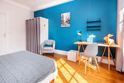 Un ou plusieurs lits dans un hébergement de l'établissement Magnifique 3 Chambres - Parking - Hyper Centre - Gare