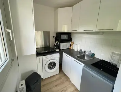 Cuisine ou kitchenette dans l'établissement Appartement avec Loggia et Parking privé