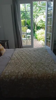 Un ou plusieurs lits dans un hébergement de l'établissement Chambre de charme
