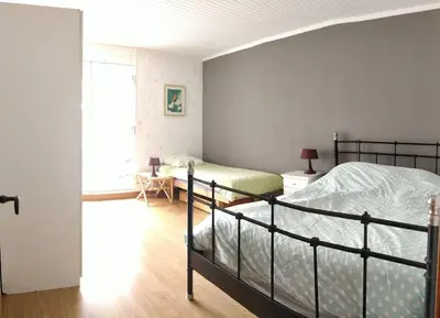 Un ou plusieurs lits dans un hébergement de l'établissement Gîte du Hérisson