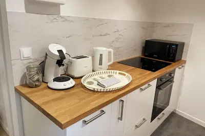 Cuisine ou kitchenette dans l'établissement Le logis du Gros Horloge - Cosy et Douillet